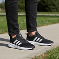 Sz 6.5 women’s Adidas running shoes  X_PLRPath Black and White Athletic Shoes